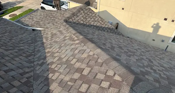 Ridge line of the completed roof above the street