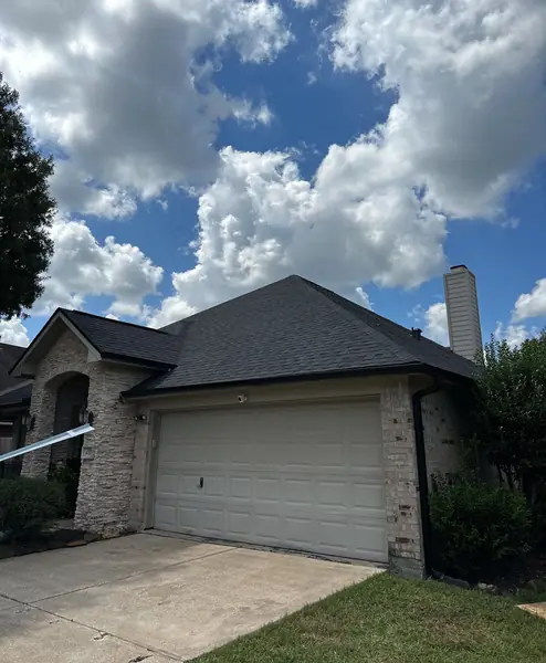 Garage and new gutters on a replaced League City roof