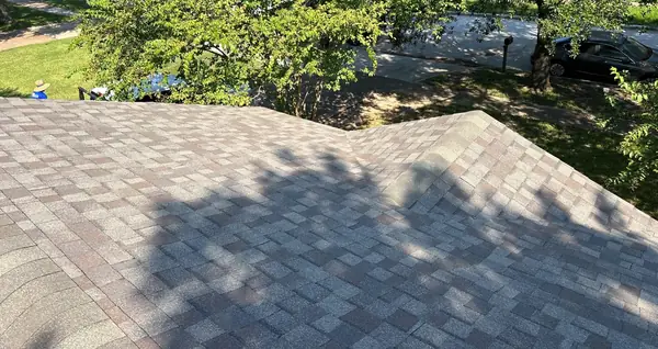 Hip ridge of a new shingle roof in Copperfield, Houston