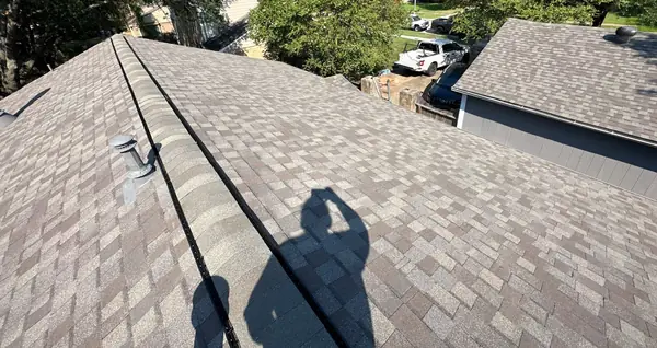 Ridge vent run on a new Weathered Wood roof in 77095