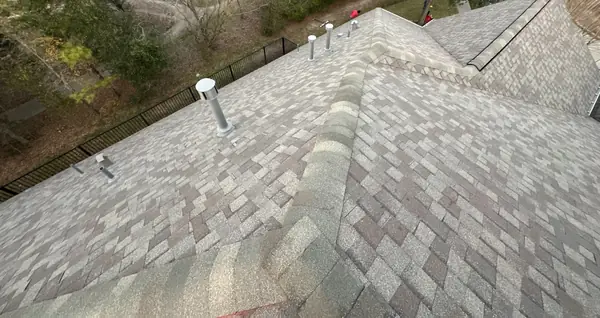 Shingle field and hip caps on the new roof