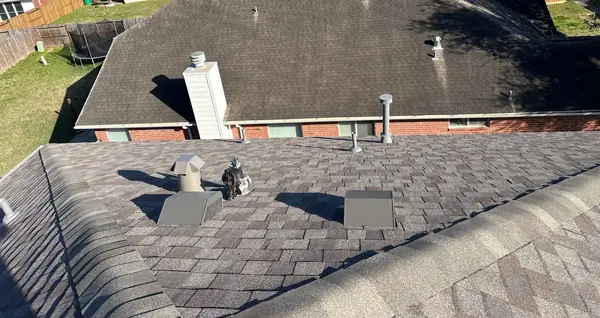 Front slope with re-flashed chimney and new vents