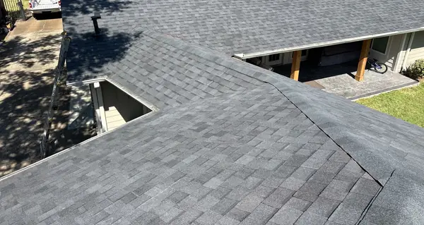 Straightened ridge line on a replaced Houston roof