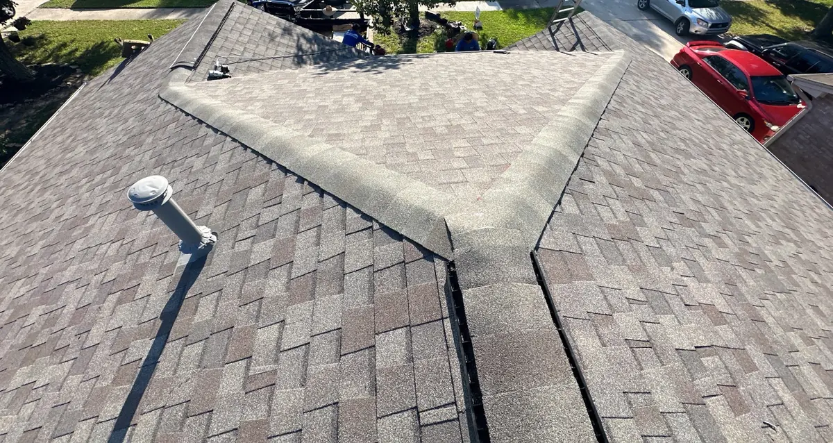 Rear elevation of a two-story Atascocita home with the new gray roof