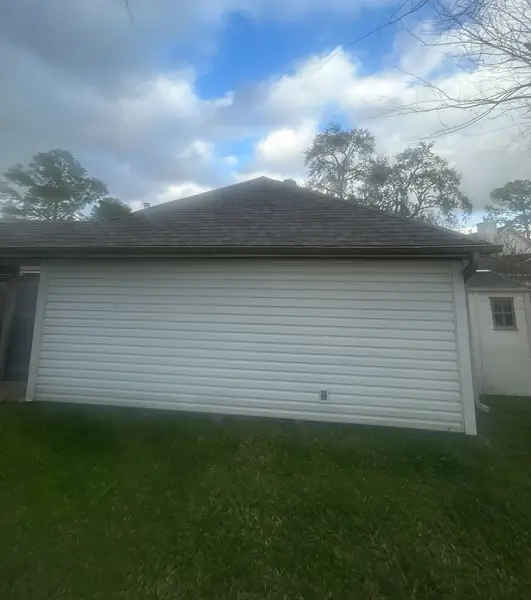 Rear elevation of a Houston home with a new roof