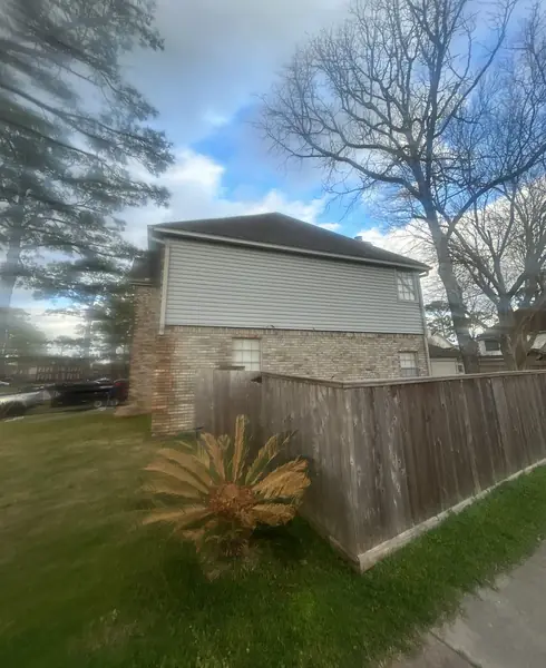 Side elevation of a Clear Lake home after roof replacement