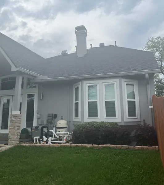 Rear elevation of a July 2024 roof replacement in Sugar Land
