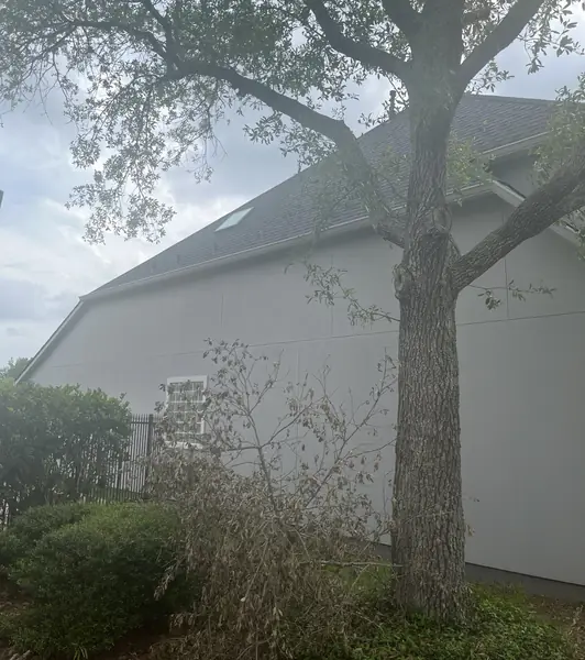 Side elevation with new gutters in Sugar Land