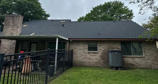 Rear elevation of a replaced roof in League City