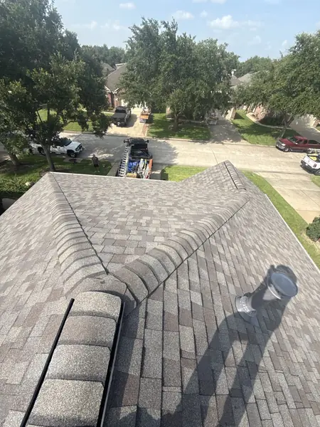Ridge cap and hip detail on a Pearland, TX roof