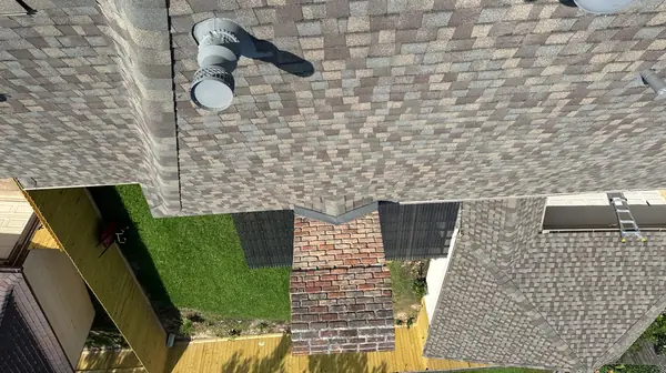 New pipe jack flashed into the shingles, seen from above