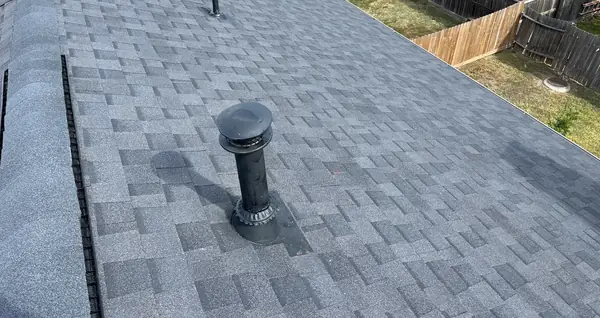 Side elevation of a Sugar Land home with a replaced roof
