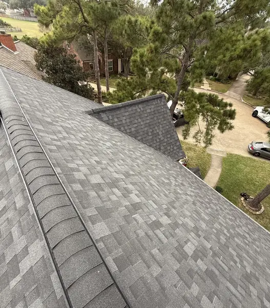 Steep front gable with fresh shingles on a February 2026 roof replacement