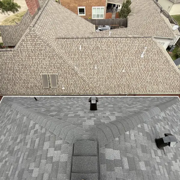 Valley and ridge detail on a replaced two-story roof in Houston, TX