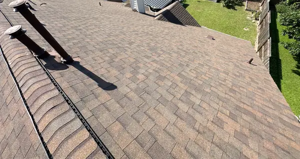 Rear hip of a new Heather Blend shingle roof in Houston