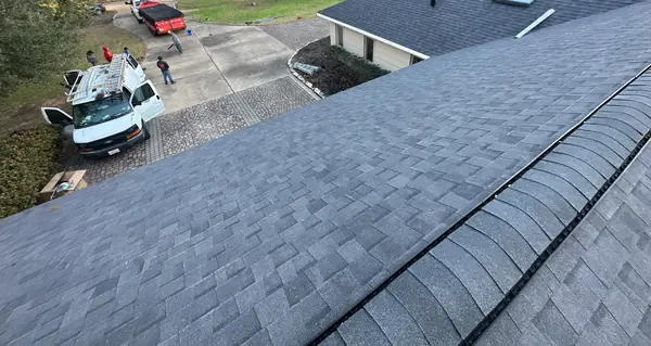 Main ridge of a charcoal Landmark roof in Katy looking toward the street