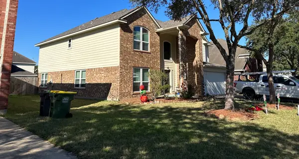 Front of a two-story Pearland home with a new roof