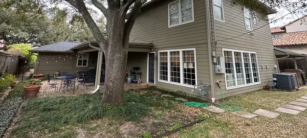 Rear of a West University area home with a new roof