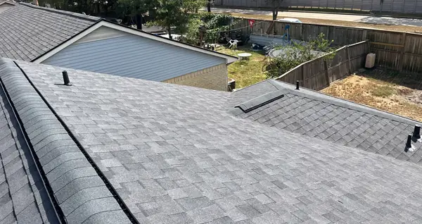 Front of a one-story Houston home with a new roof