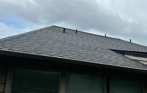 Rear slope of a replaced two-story roof in Sugar Land