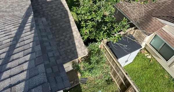 Chimney with new flashing on a charcoal roof in Cypress
