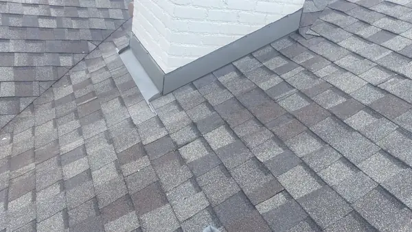 Low hip ridge of a September 2025 roof replacement in Houston