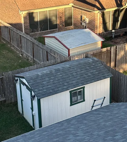 Backyard shed roof shingled to match the main house in Houston, TX