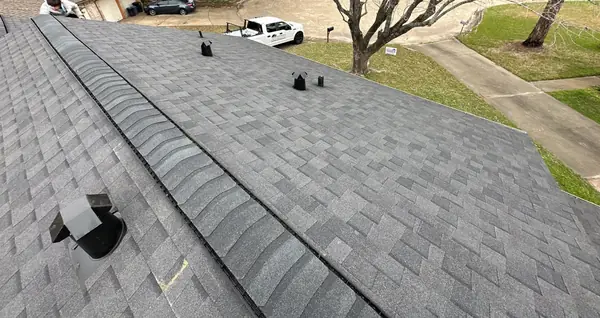 New lead pipe jacks on a driftwood laminate roof in Houston, TX