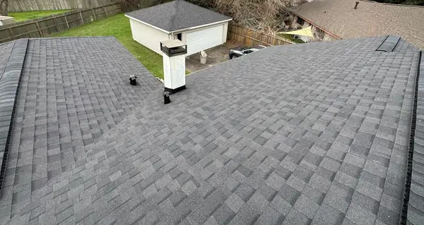 Ridge vent replacing turbines on a one-story Houston roof