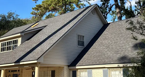 Front shed dormers and skylight on a north Houston roof replacement