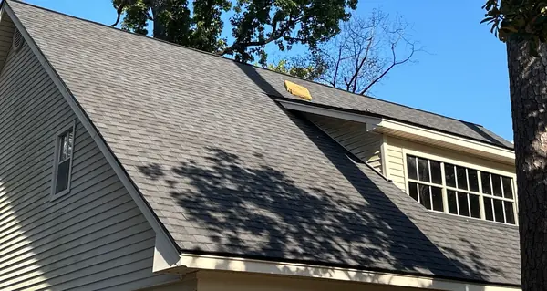 Front elevation showing both dormers and the new shingles