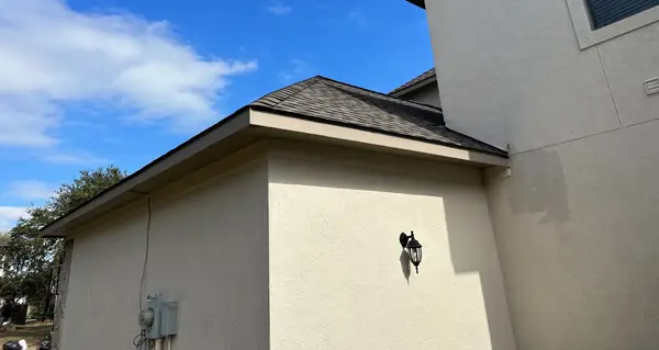Corner detail of the completed roof and stucco, Katy 77494