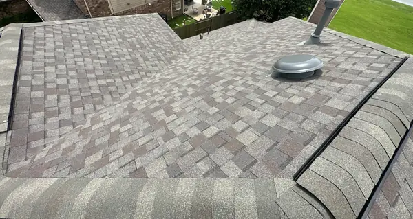Ridge cap and valley detail on a new League City roof