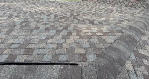 Hip lines of the new gray-blue shingle roof