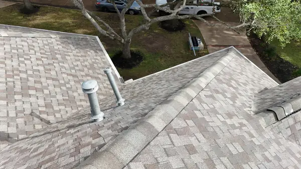 Ridge cap and valley detail on a new Houston roof