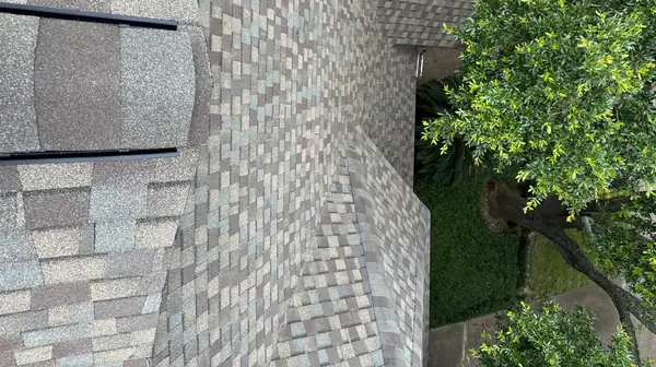 Shingle field of a new gray-brown roof in Katy
