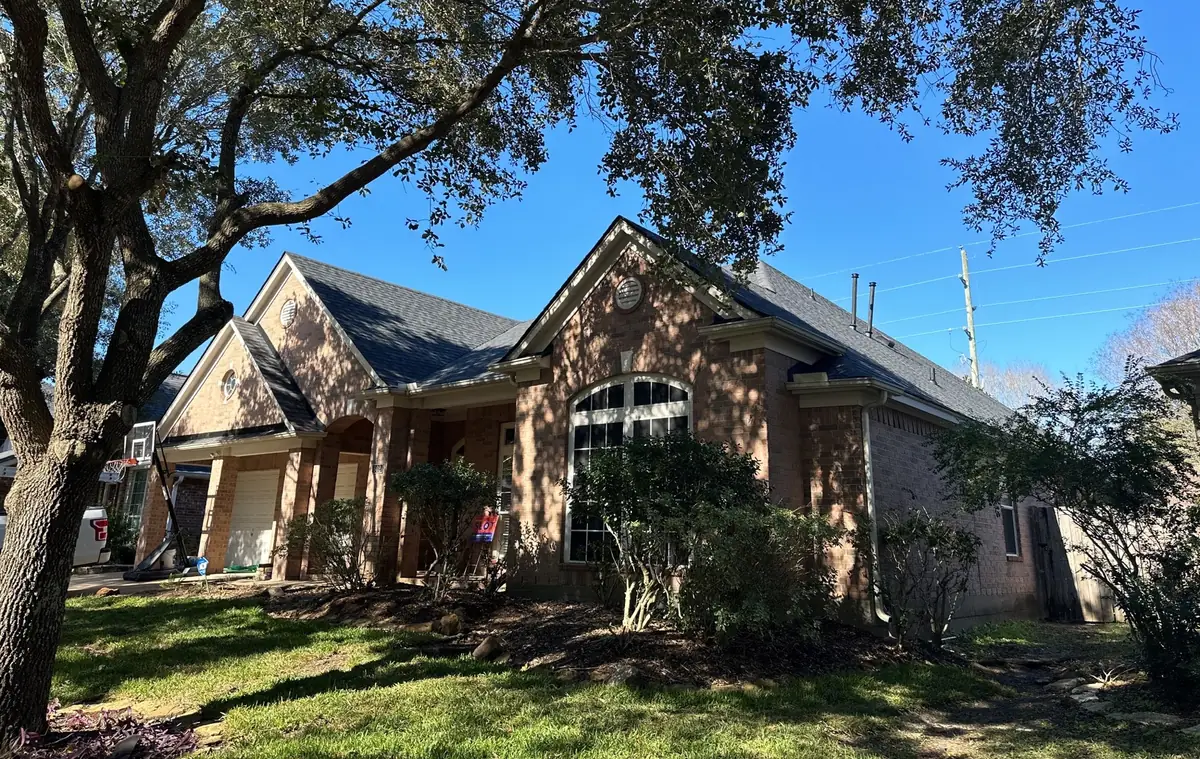 One-story brick Richmond home in 77406 with a new driftwood laminate roof