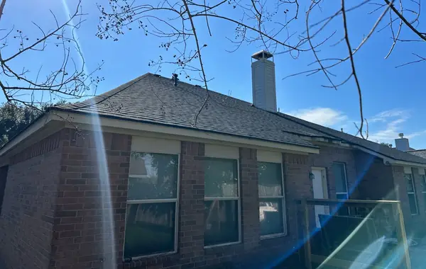 Brick chimney re-flashed on a new Richmond roof
