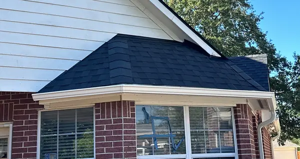 Breakfast-room bay with a new shingle roof in northwest Houston