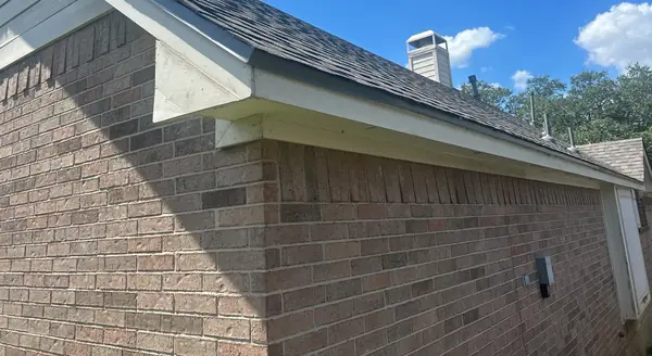 Brick corner and new roof edge on a Houston home
