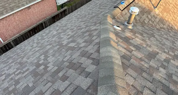 Replaced pipe boots and ridge on a northwest Houston roof