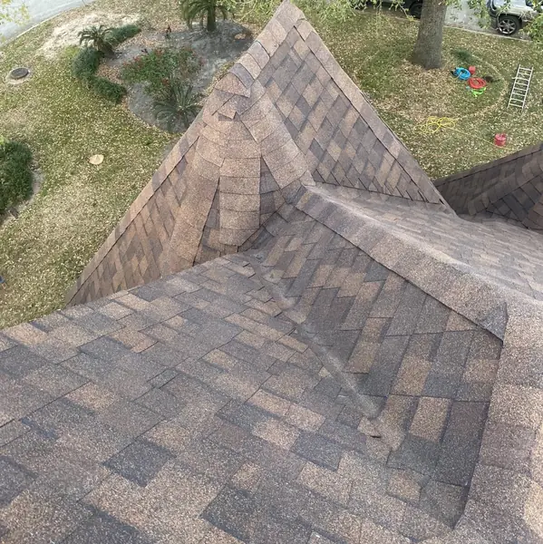 Steep front slope with fresh shingles on an April 2025 Houston roof