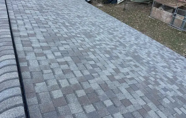 Driftwood laminate roof on a one-story Magnolia home in 77355