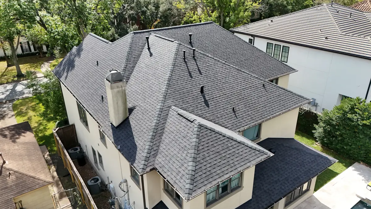 Charcoal laminate roof on a two-story stucco home in Bellaire 77401