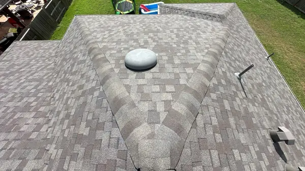 Shingle field and dome vent on the main slope
