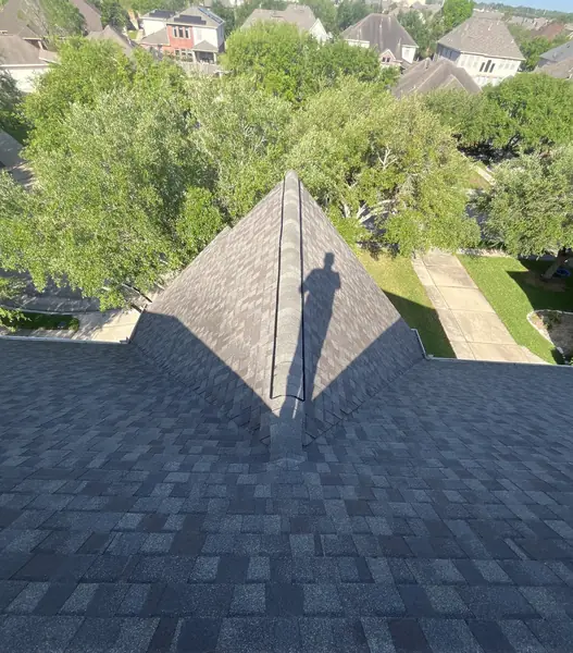 Ridge vent run on a steep Pearland roof