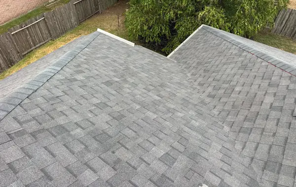 Side slope with new shingles and drip edge