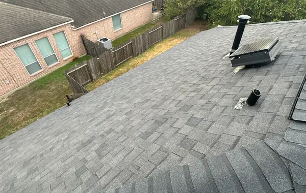 Reused solar attic fan flashed into the new roof