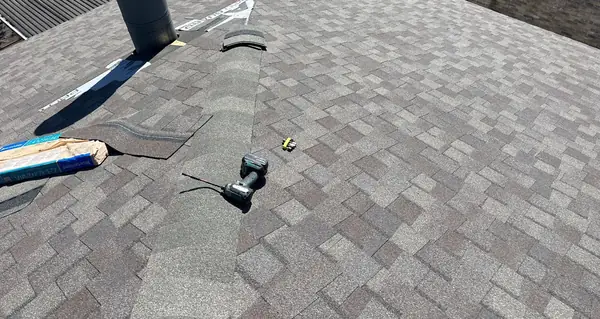 Exhaust vent and new flashing on a replaced roof in northwest Houston