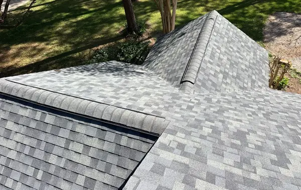 Driftwood laminate roof and brick chimney on a Hockley home in 77447